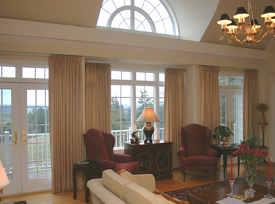 Spacious Living Room with Barrel Windows and Deck